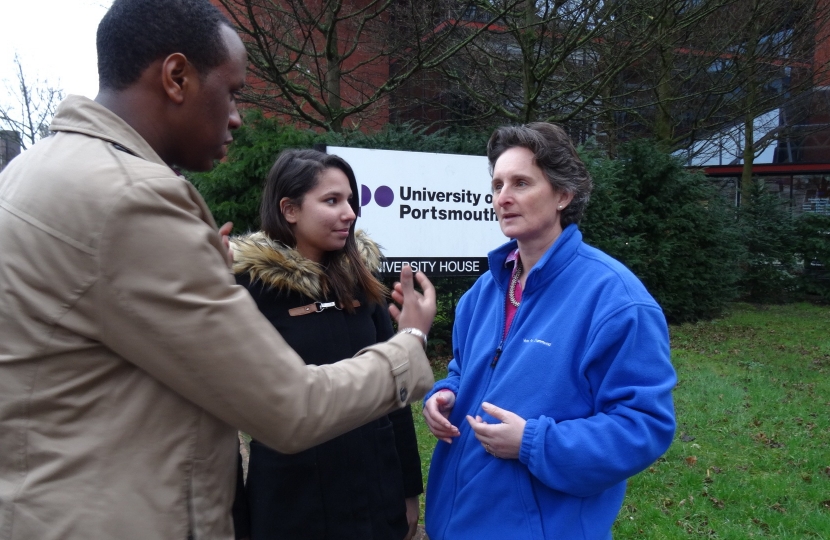 Flick talking to some students outside the University of Portsmouth